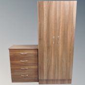 A three piece contemporary bedroom suite comprising of double door wardrobe,