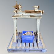 A vintage industrial lathe with motor