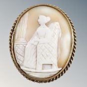 A vintage gilt cameo brooch