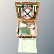 A wicker cased picnic set