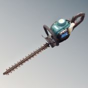 A Qualcast petrol hedge trimmer