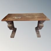 A side table on carved supports