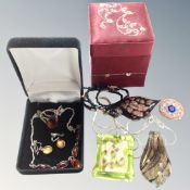 A silver and amber ring and matching necklace,