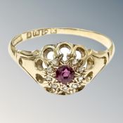 An 18ct gold ruby and diamond cluster ring, size R. CONDITION REPORT: 2.8g.