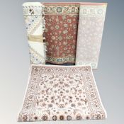 A fringed woolen rug of geometric design,