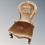 A Victorian mahogany nursing chair in brown dralon