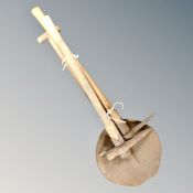 A vintage coal miner's shovel with two picks