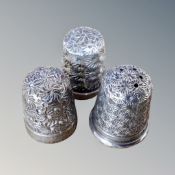 Three hall marked silver thimbles,