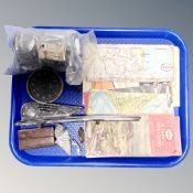 A tray of vintage folded Esso maps, car bonnet mascot,