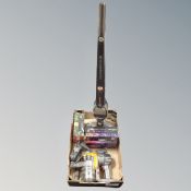 A box of Dyson hand held vacuum with accessories,