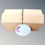 A thirty-two piece pink orchid dinner service, boxed.