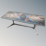 A 1970's tiled topped coffee table on chrome legs