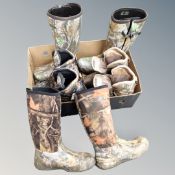 A box of four pairs of camouflage gent's boots and Wellingtons
