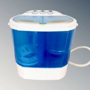 A Leisure direct twin tub counter topped washing machine together with an oil filled radiator and