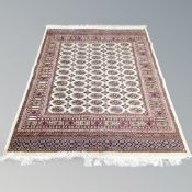 A modern Tekke design rug on cream ground,