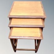 A nest of three 20th century G-Plan teak tables