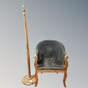 A beech and wicker tub chair together with further beech standard lamp