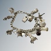 A silver charm bracelet CONDITION REPORT: 79g