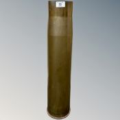 A heavy artillery brass ammunition shell casing, various engraved markings to base,