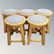 A set of five bar stools