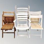 A pair of mid 20th century folding wooden chairs,