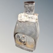 A cast iron log burning stove