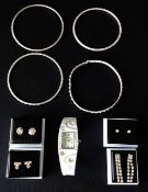 A diamante encrusted ladies watch, diamante boxed earrings and bangles.