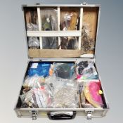 An aluminium case containing fly making equipment