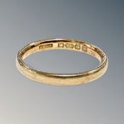 An 18ct gold band ring, size L CONDITION REPORT: 2.