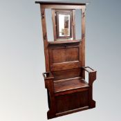An Edwardian oak mirrored hall stand