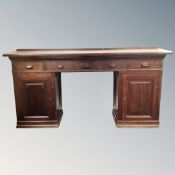 An early 20th century twin pedestal clerk's writing desk,