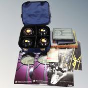 A Mitre lawn bowls bag containing set of four Taylor Thomas lawn bowls, vintage books,