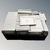 A box containing a quantity of Xenos and Fotolijst picture frames, new.