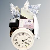 Two contemporary magazine racks together with cushions, circular wall clock, Hurricane lamp,