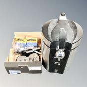 A Beer Monster beer dispenser with accessories.