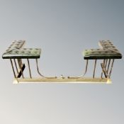 A brass and green button leather upholstered club fender.