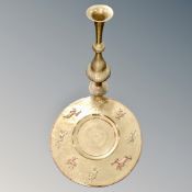 A very large brass wall plaque with central sun motif and applied copper hunt scenes,