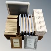 A box containing a quantity of Xenos and Fotolijst picture frames, new.