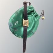 A lady's Longines gold-plated and stainless steel wristwatch on leather strap.