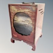 A Japanese lacquered storage cabinet with handle.