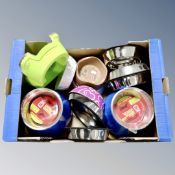 A box containing new dog food and water bowls.