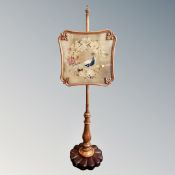 A 19th century mahogany and beech tapestry pole screen.