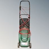 A Qualcast Cobra Quiet 32 electric lawn mower with grass box and lead.