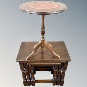 A nest of three oak tables together with a wine table