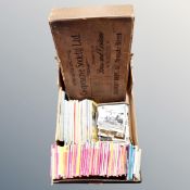 A box of Ordnance Survey maps, 20th century postcards,
