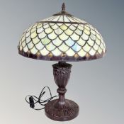 A Tiffany style table lamp with leaded glass shade