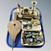 A tray of antique and later brass wares, wooden bellows,