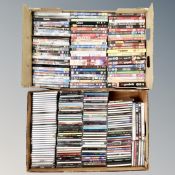 Two boxes containing assorted DVDs and CDs, various.