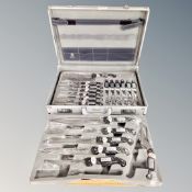 A cased Rostfrei chef's knife and steak knife set in aluminium case