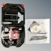 A Black and Decker router, in case, together with a Diamond Wheel tile cutter.
